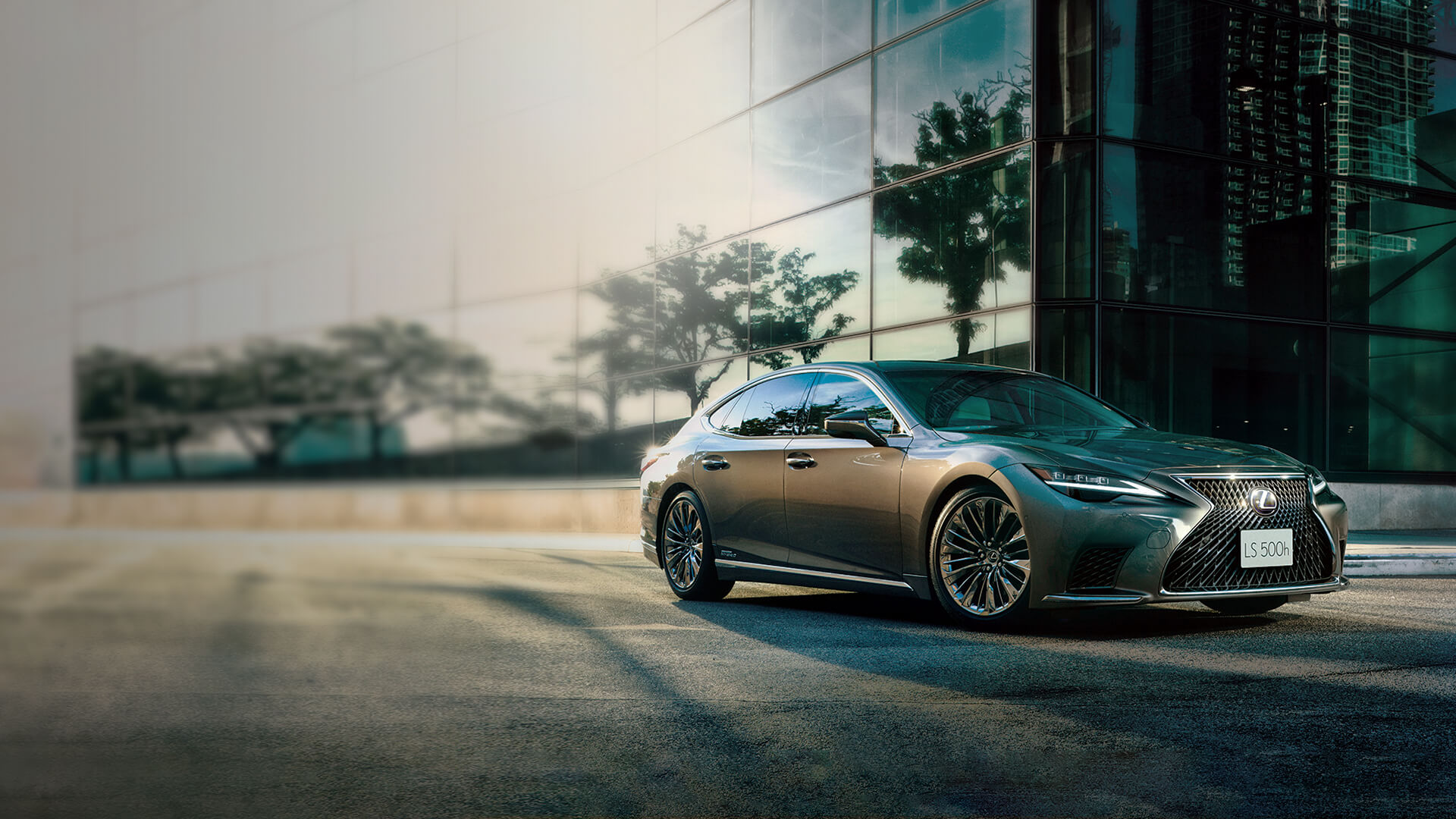 Blue NX parked next to a building.