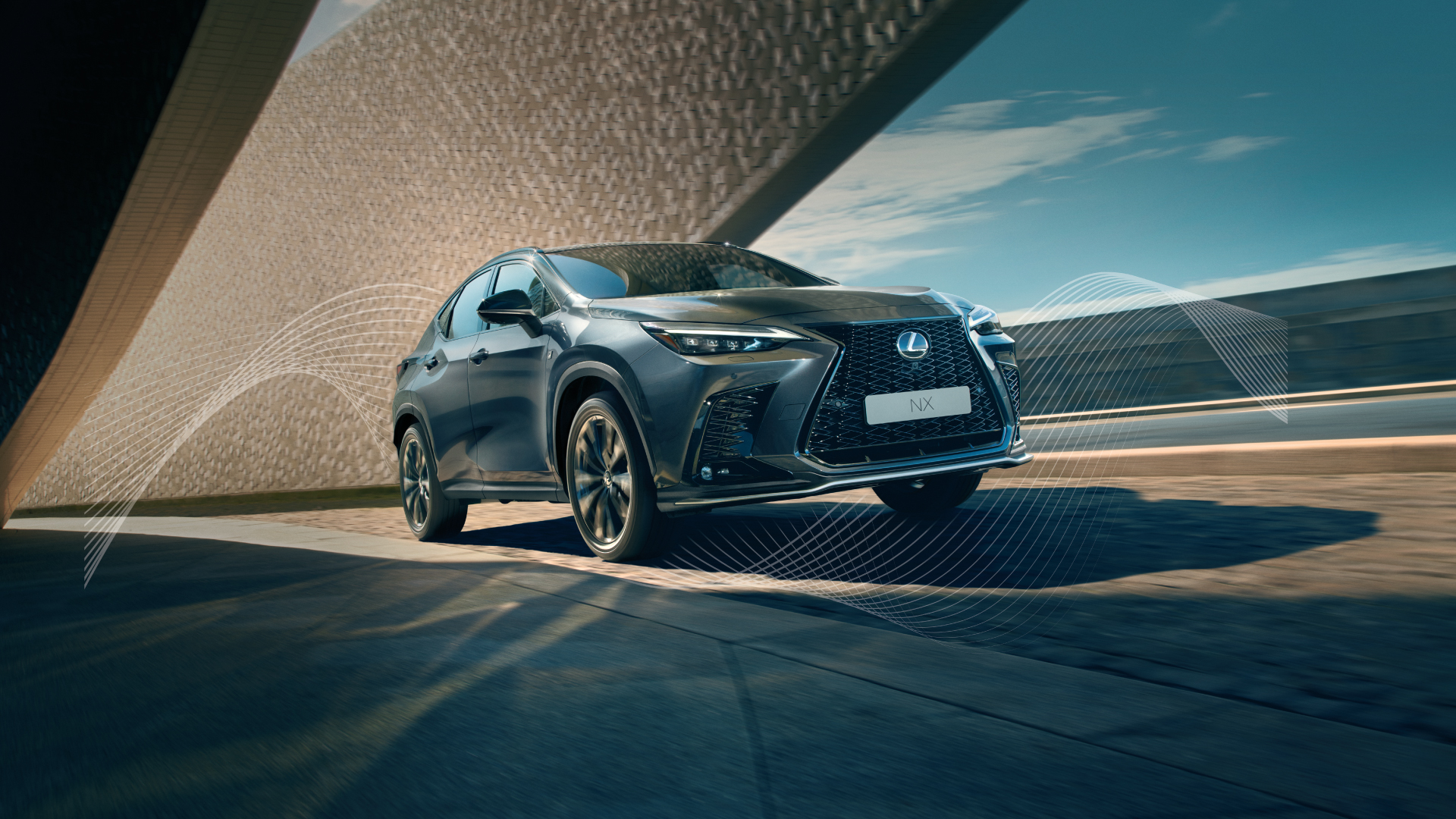 Green NX being driven on the road.